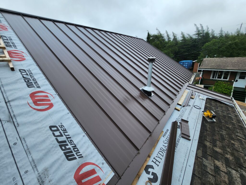 Brown steel roof with vent pipe installed by Freedom Metal Roofing NL
