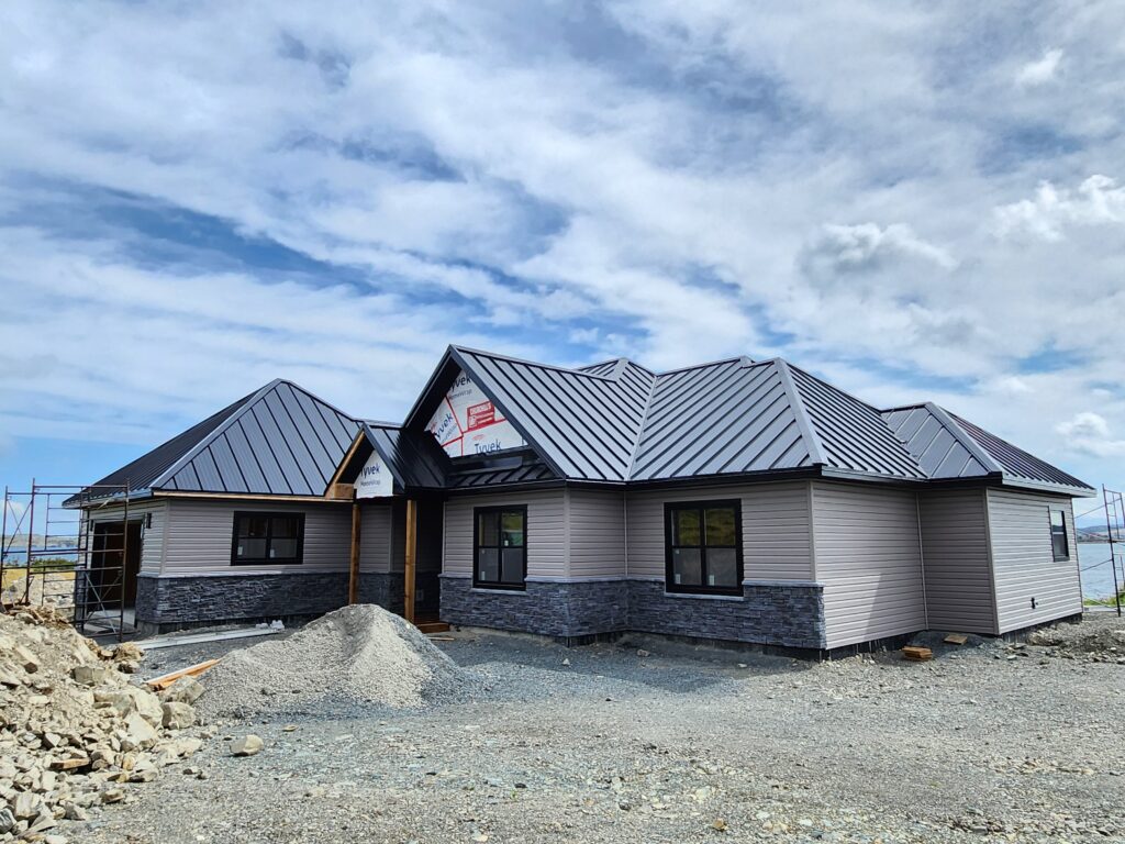 Residential steel roof installation with multiple peaks by Freedom Metal Roofing NL