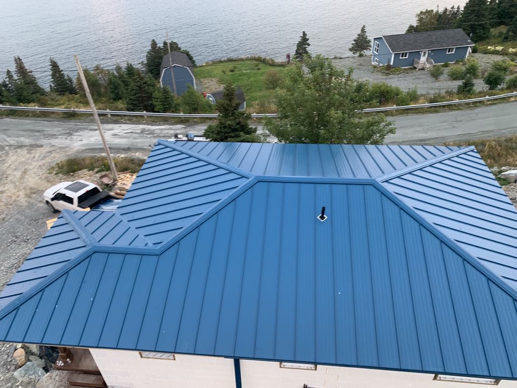 House with a steel roof installed to last by Freedom Metal Roofing NL
