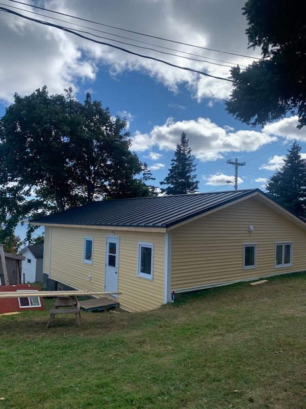 Black steel gable roof installed by Freedom Metal Roofing NL
