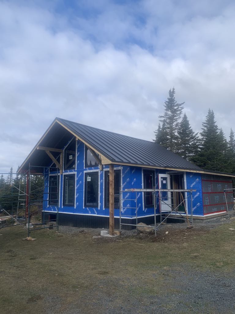 Black steel gable roof installed by Freedom Metal Roofing NL
