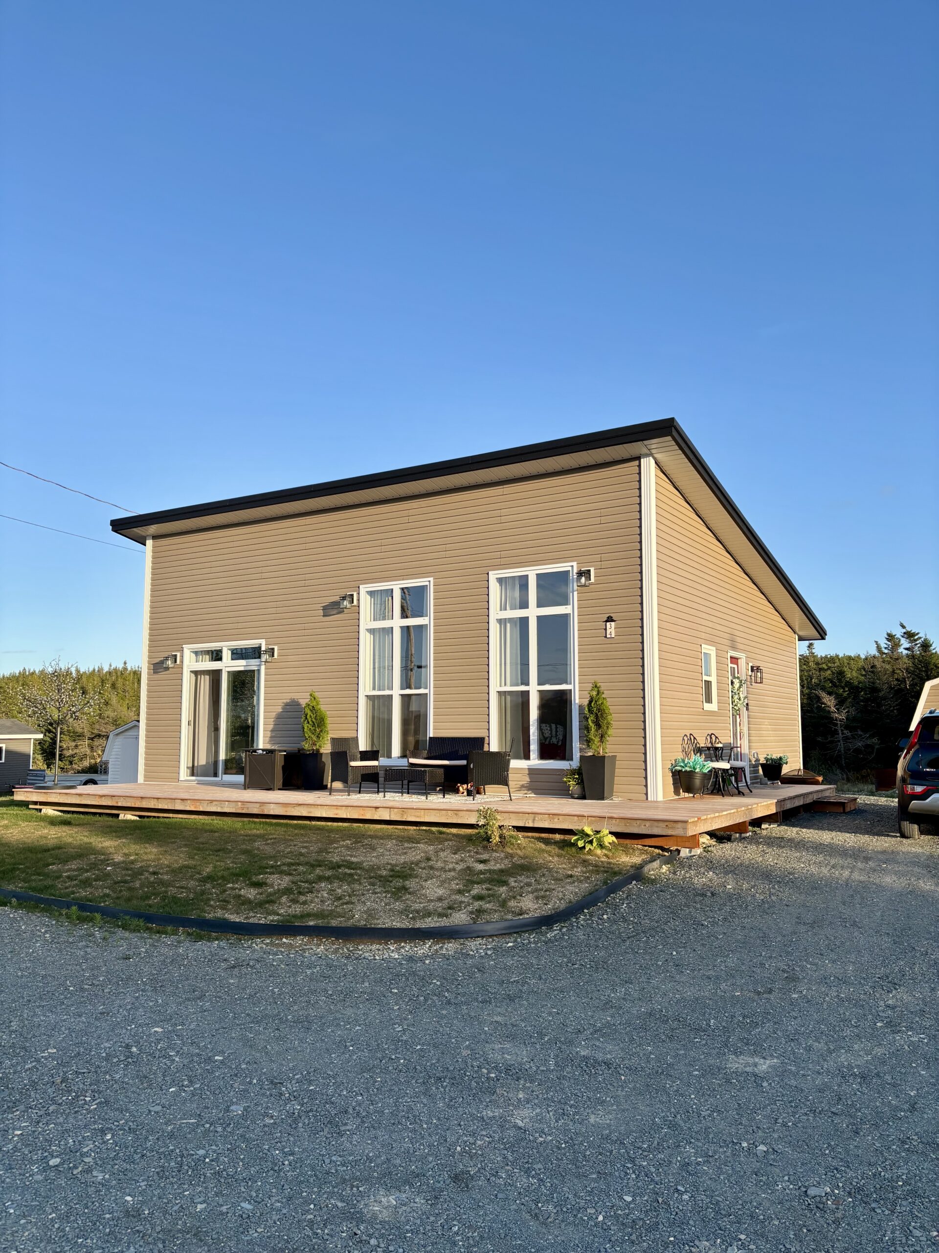 Residential house with steel roof installed by Freedom Metal Roofing NL, featured in customer testimonial
