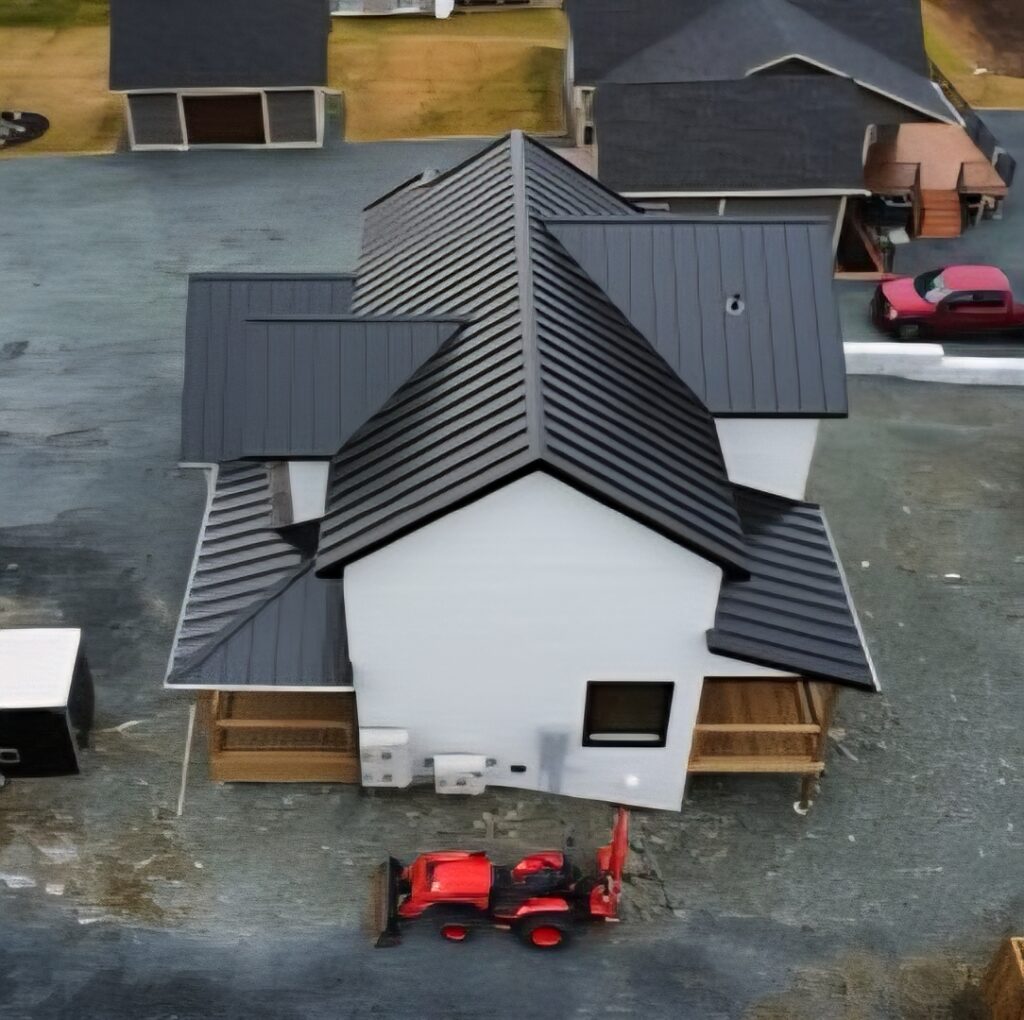 Drone view of right side roof slope showing finished metal roofing