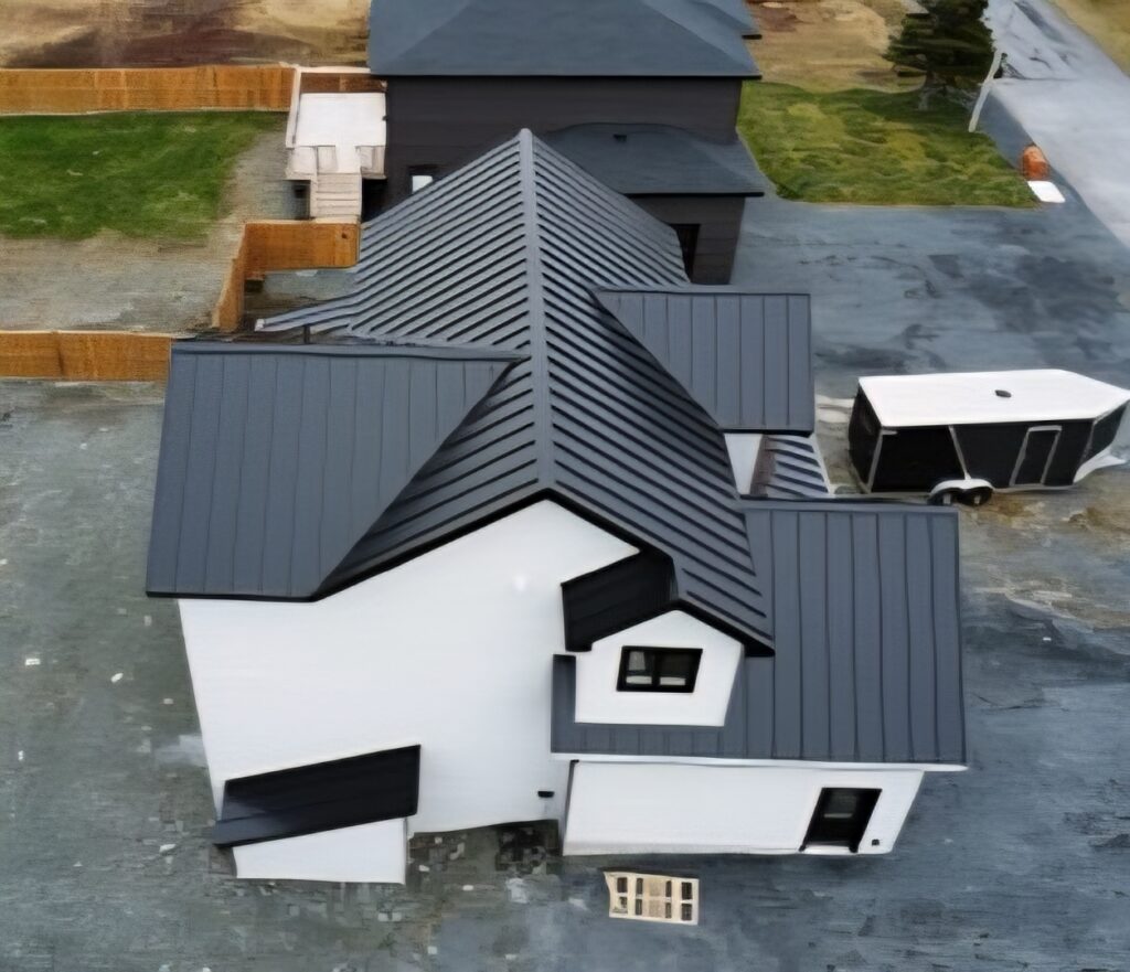 Drone view of left side roof slope with metal roofing panels installed