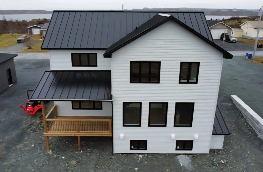 Aerial rear view of standing seam metal roof installed on home